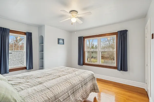 a bedroom with a large bed and a large window