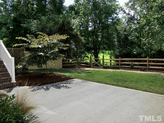 a view of park with large trees