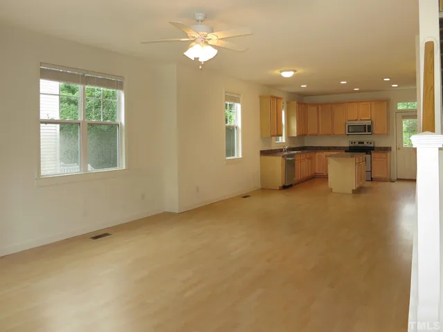 a view of a kitchen with a sink and microwave