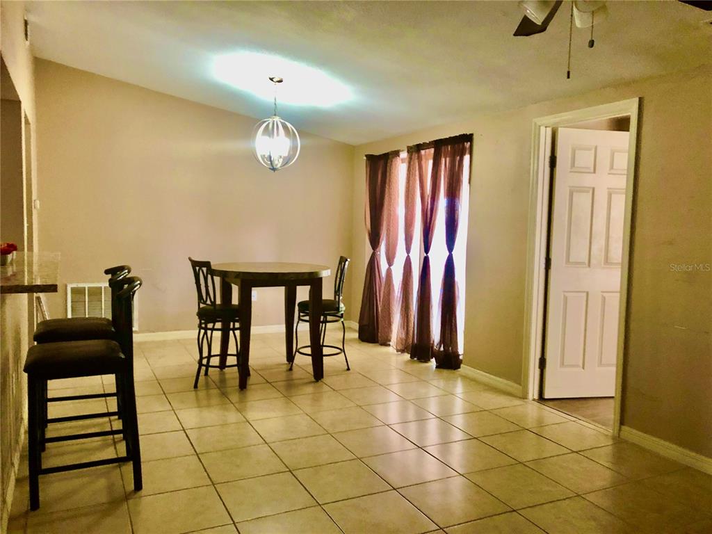 7537 Jasmine Boulevard Port Richey, FL 34668 - Photo 5 of 15 a view of a livingroom with furniture and a window