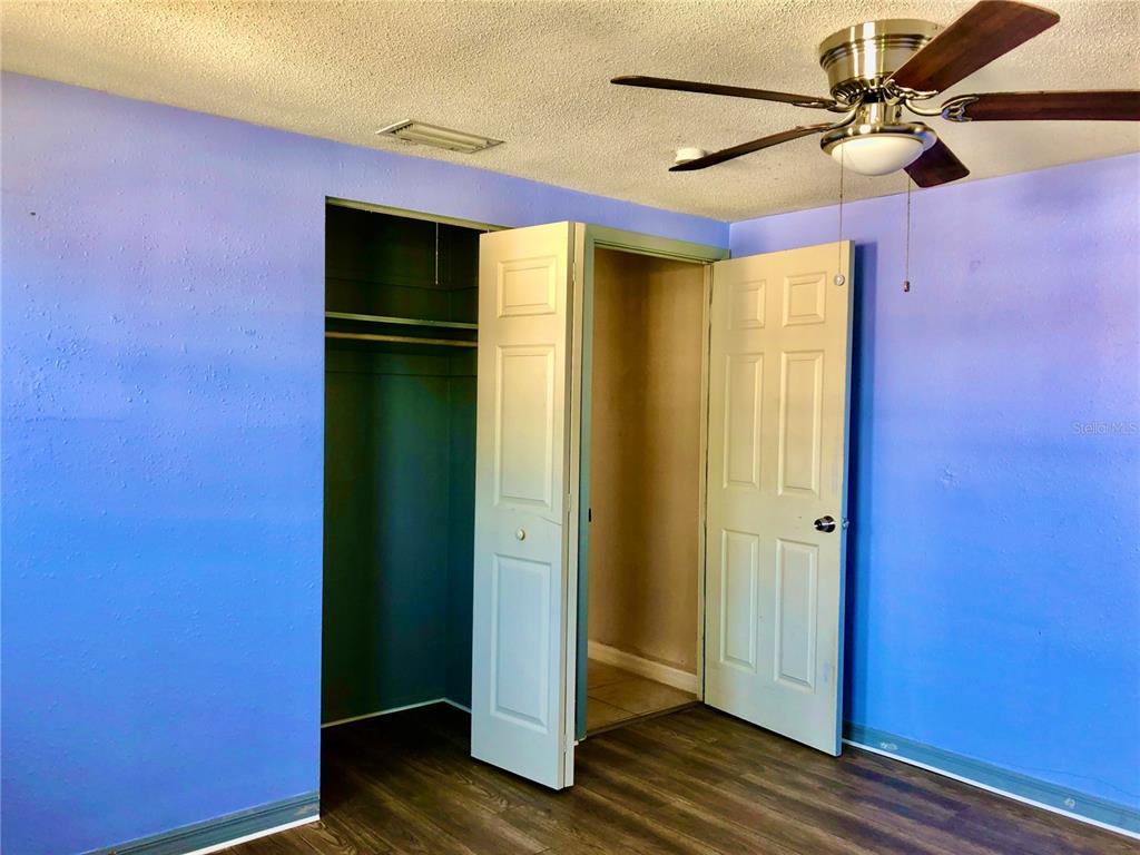 7537 Jasmine Boulevard Port Richey, FL 34668 - Photo 9 of 15 a view of empty room with wooden floor