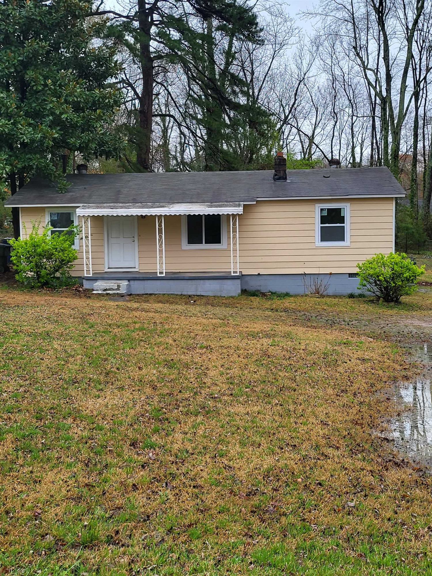 front view of a house with a yard