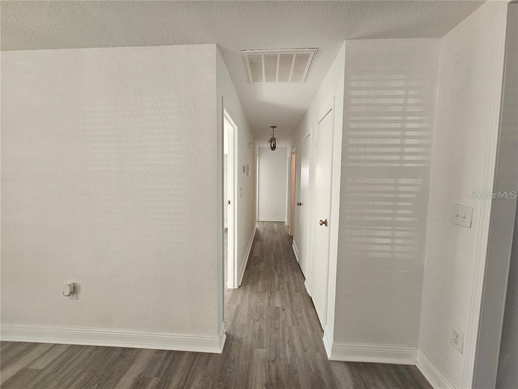2349 Lisa Street Lake Wales, FL 33898 - Photo 11 of 16 a view of a hallway with wooden floor