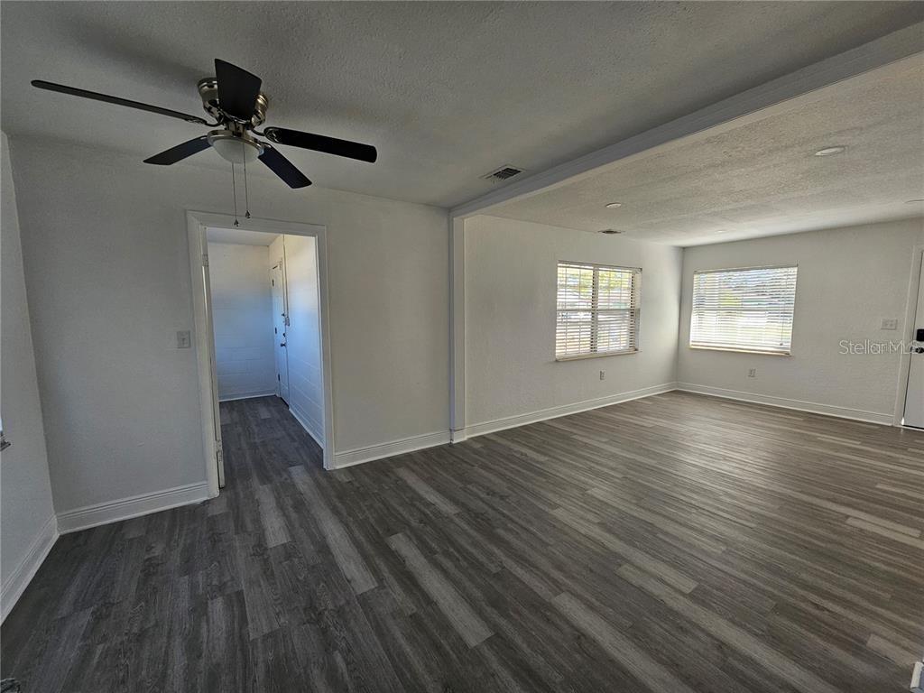 2349 Lisa Street Lake Wales, FL 33898 - Photo 8 of 16 wooden floor in an empty room with a window