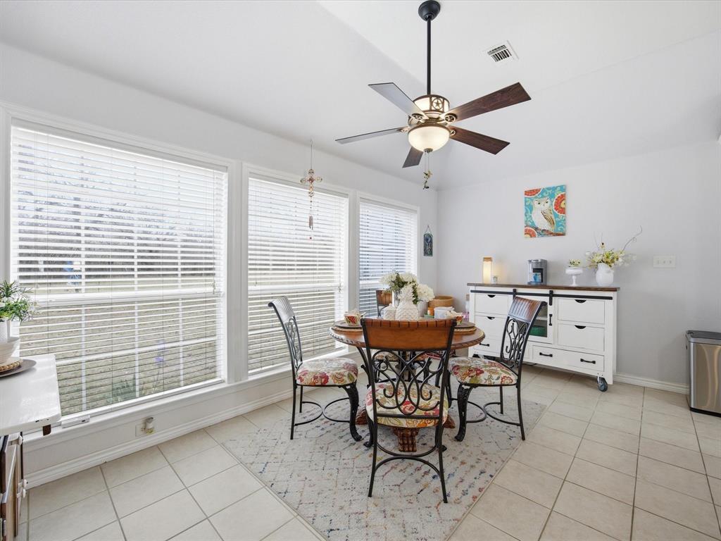 321 Niki Road Paradise, TX 76073 - Photo 16 of 40 a view of a dining room with furniture and a window
