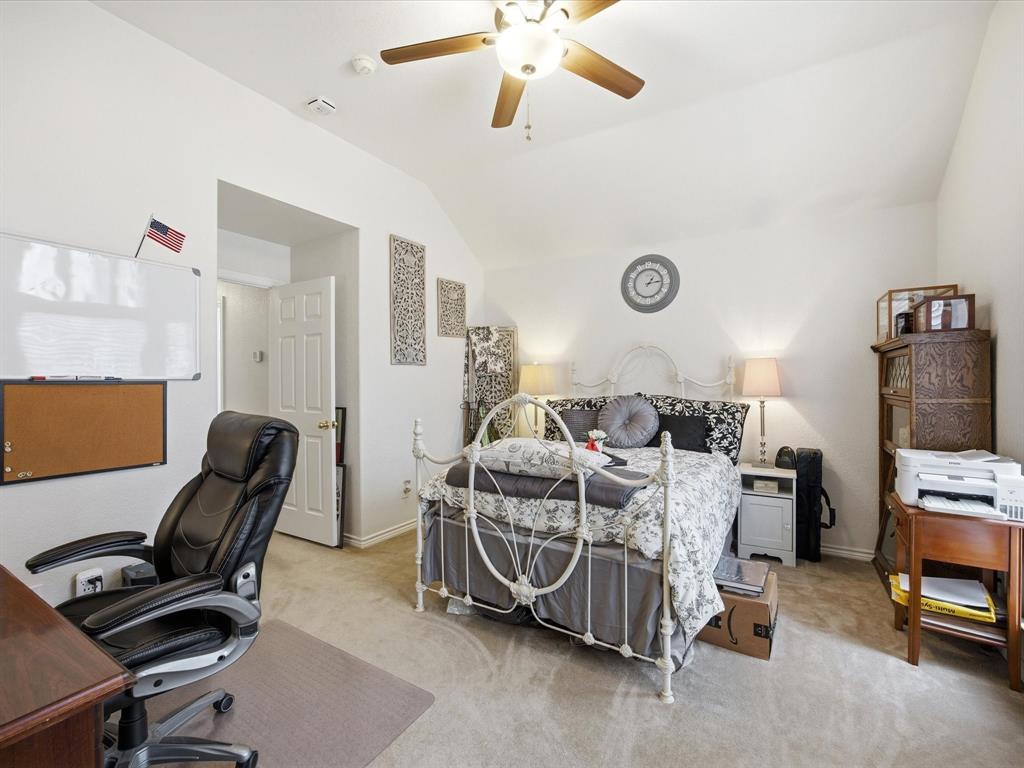 321 Niki Road Paradise, TX 76073 - Photo 23 of 40 a bedroom with bed and a chair