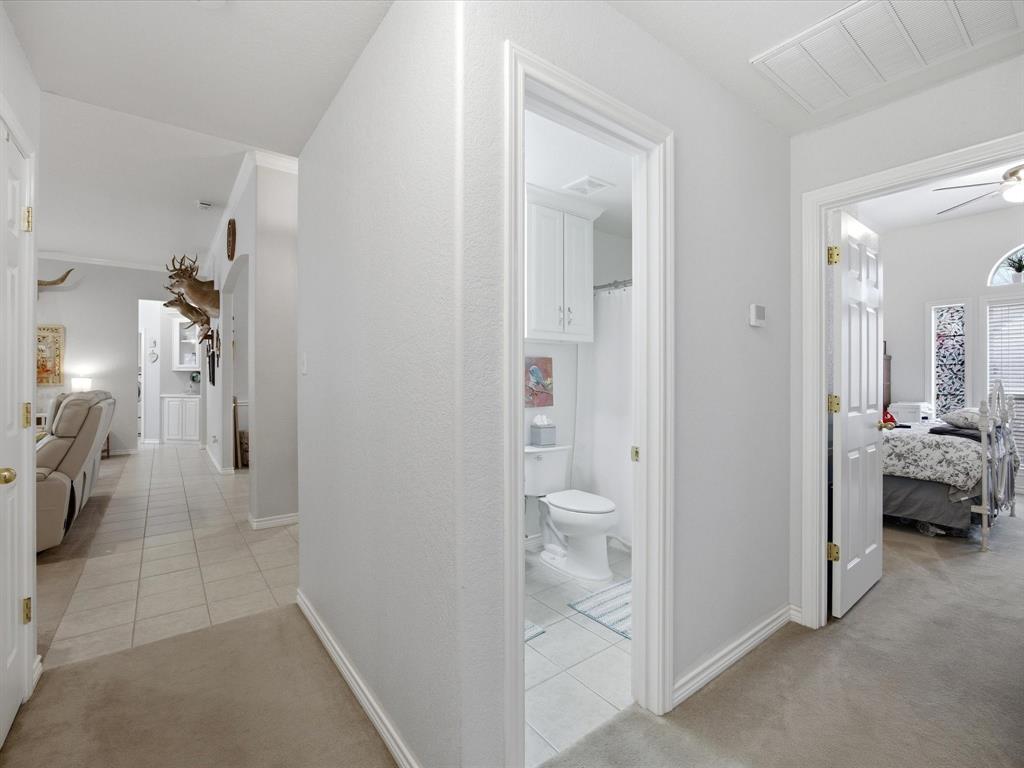 321 Niki Road Paradise, TX 76073 - Photo 25 of 40 a view of a bedroom from a hallway