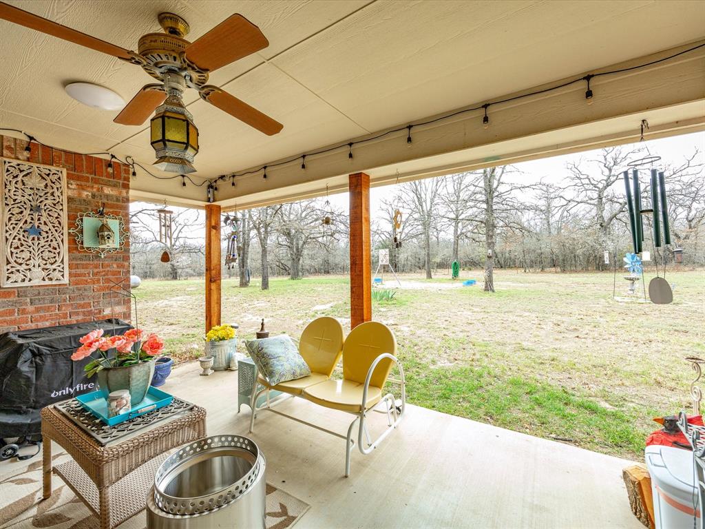 321 Niki Road Paradise, TX 76073 - Photo 28 of 40 a living room with furniture and a large window