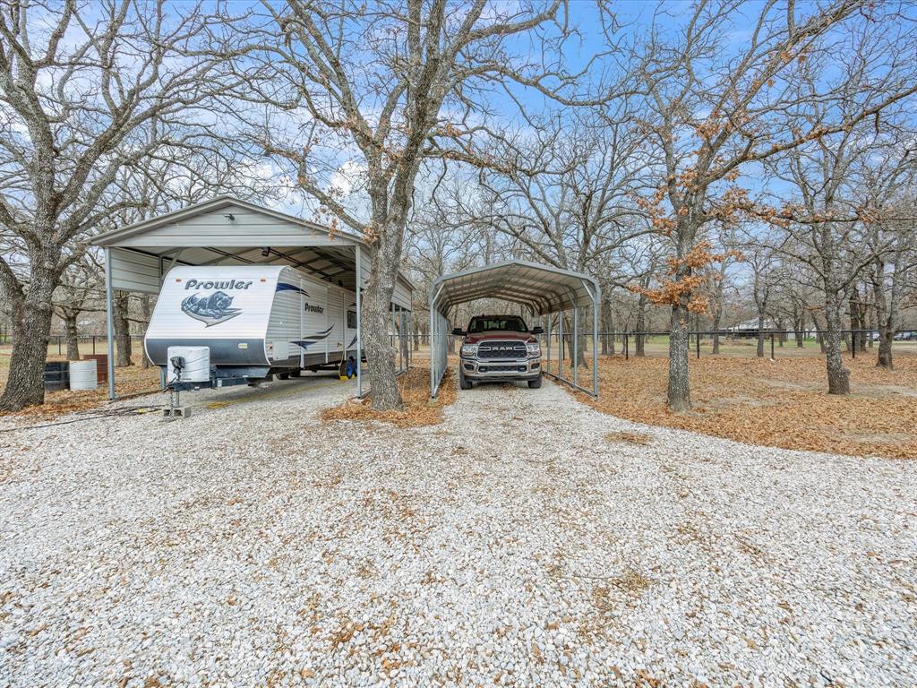 321 Niki Road Paradise, TX 76073 - Photo 32 of 40 a front view of a house with a yard covered in snow