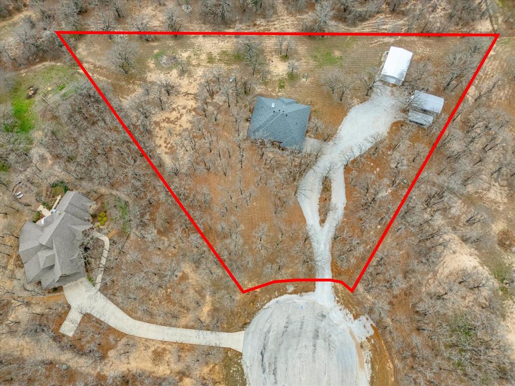 321 Niki Road Paradise, TX 76073 - Photo 37 of 40 a view of a living room with a bed