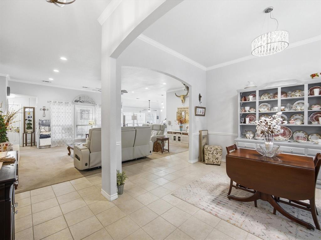 321 Niki Road Paradise, TX 76073 - Photo 5 of 40 a room with stainless steel appliances kitchen island granite countertop furniture and a view of living room