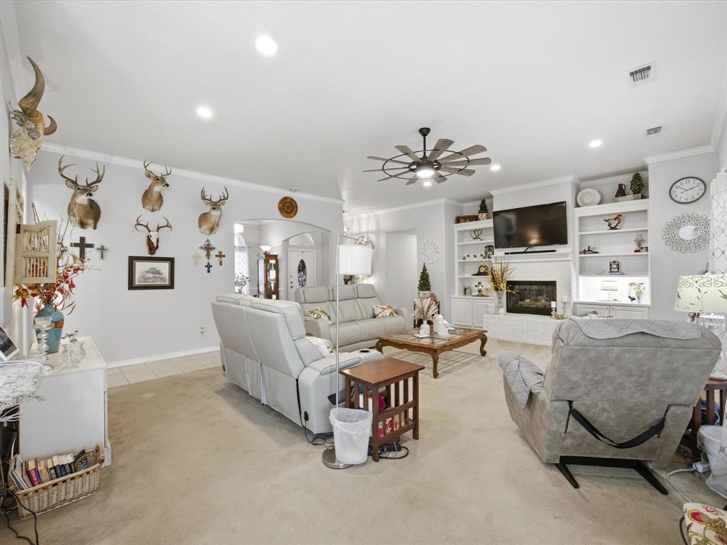 321 Niki Road Paradise, TX 76073 - Photo 7 of 40 a living room with furniture and a fireplace