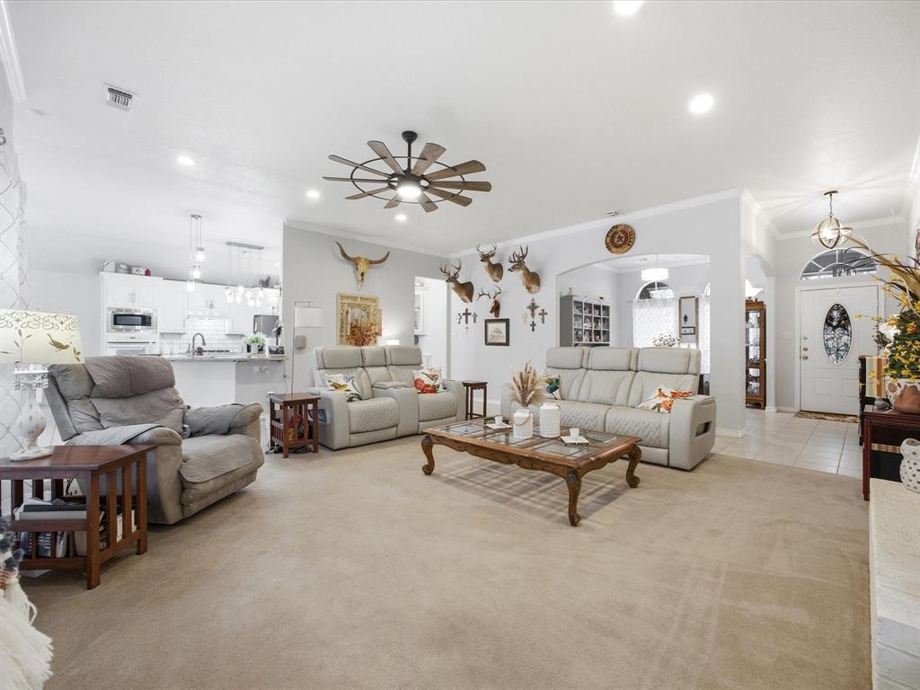 321 Niki Road Paradise, TX 76073 - Photo 8 of 40 a living room with furniture and a chandelier