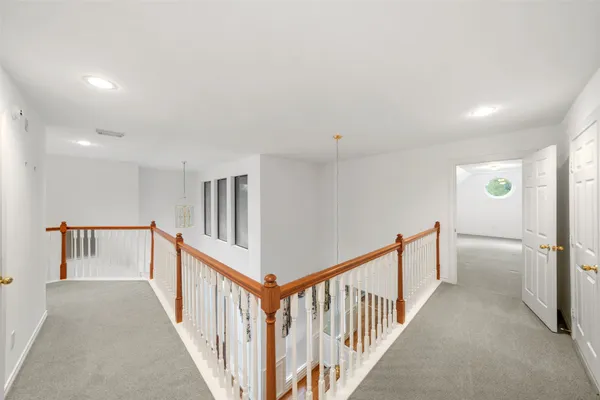 a view of staircase with white walls
