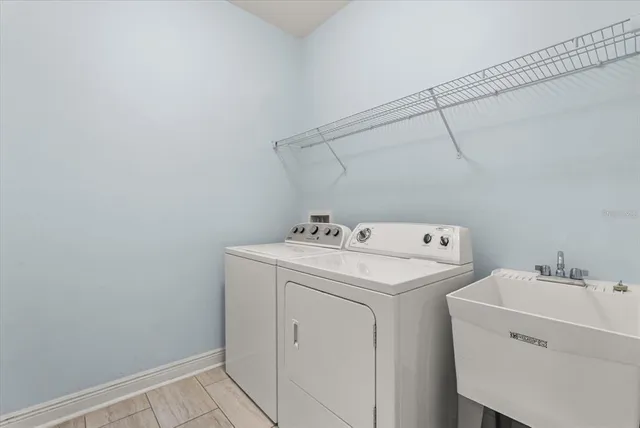 a utility room with dryer and washer