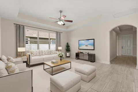 a living room with furniture and a large window