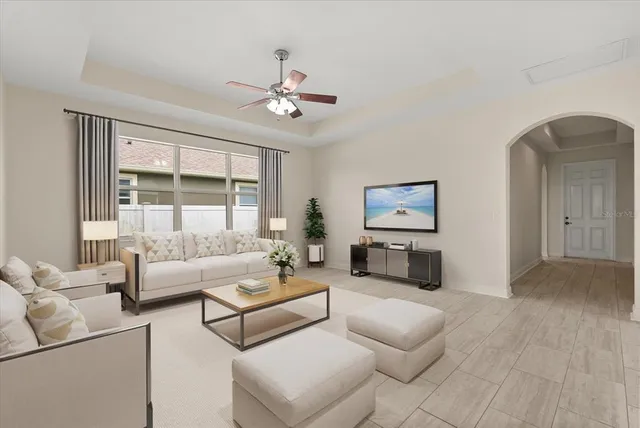 a living room with furniture and a large window