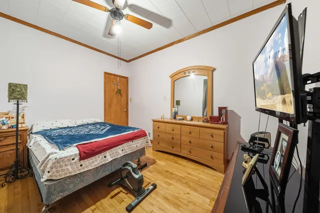 a living room with a bed furniture and a window
