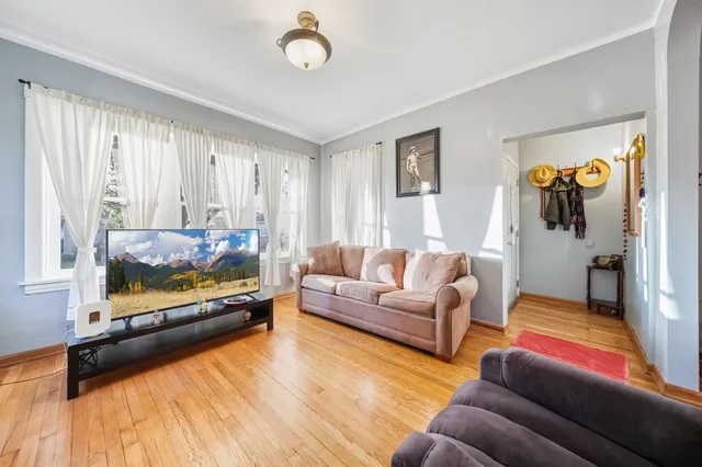 a view of a dining room with furniture and a window