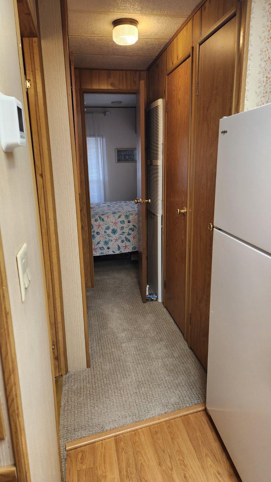 111 Beach Harbor Road, Unit 194C Grasonville, MD 21638 - Photo 5 of 24 Storage closet and laundry room in hall