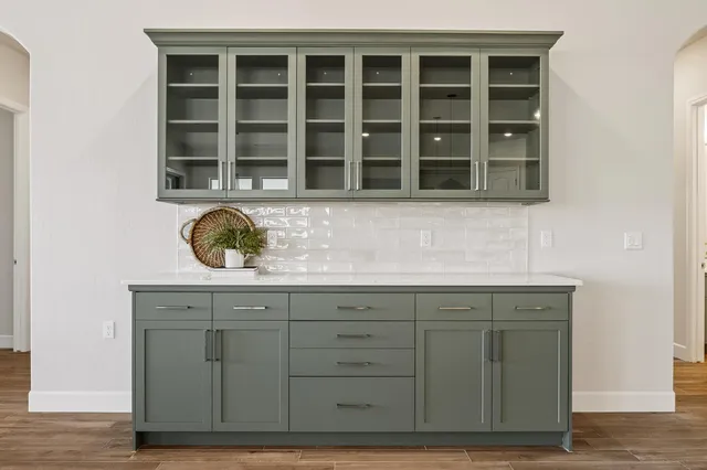 a view of wooden cabinets and a wooden floor