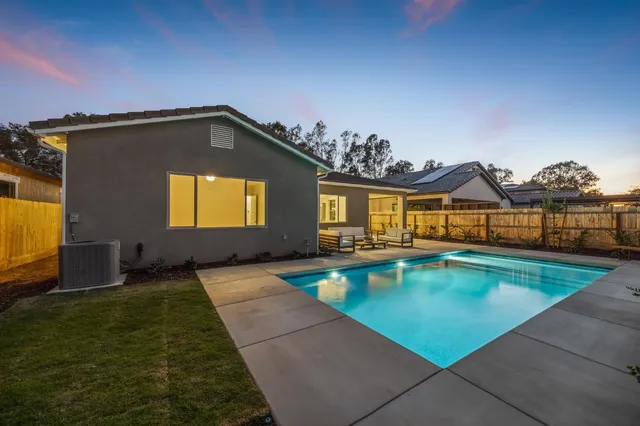 a view of a house with swimming pool