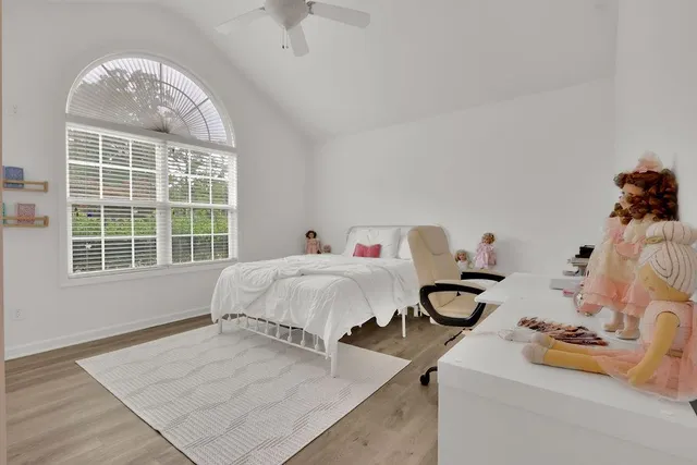 a bedroom with bed and window