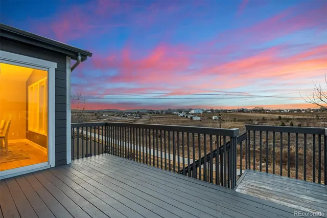 a view of balcony with wooden floor and city view