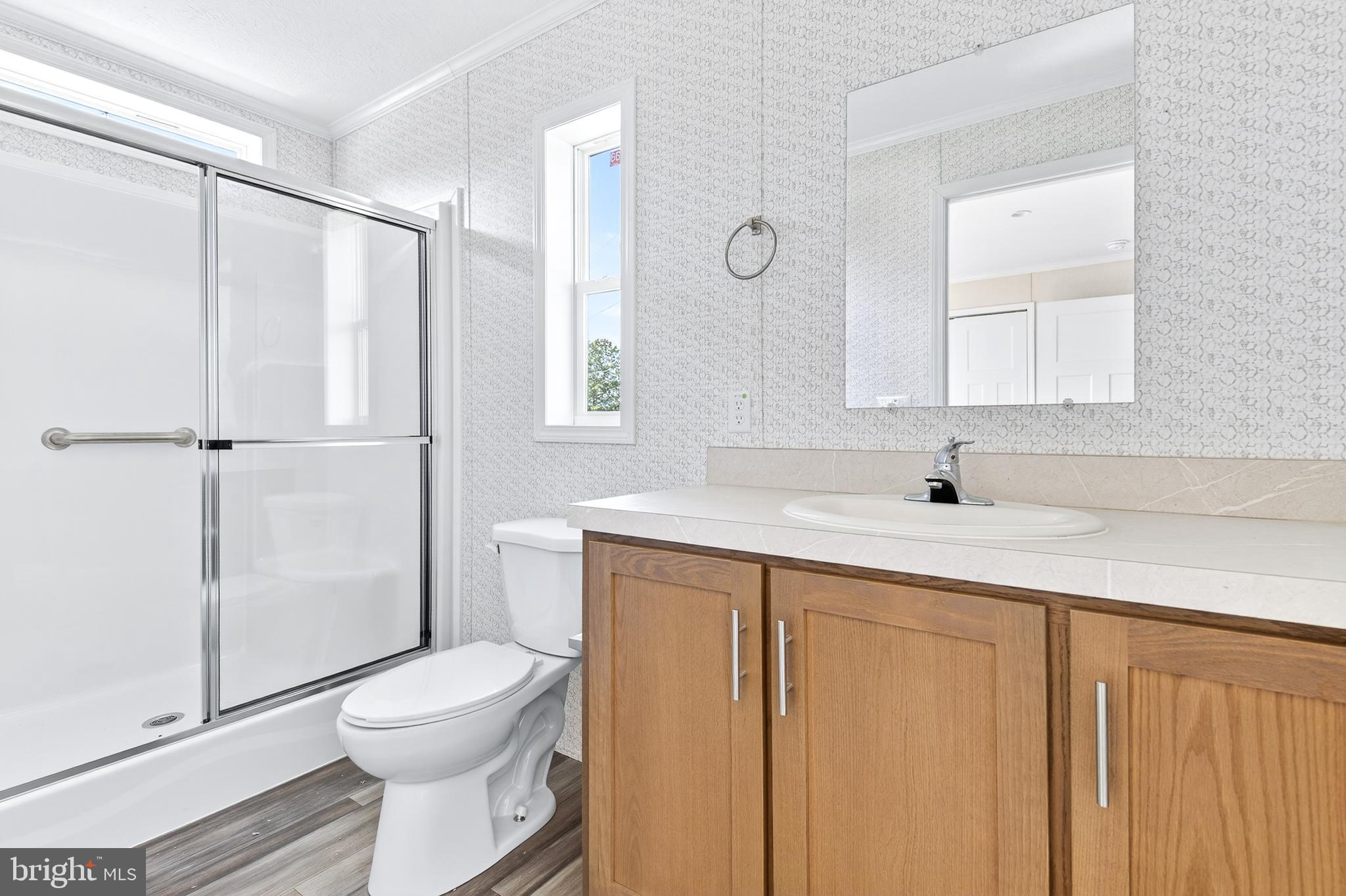 313 Bordic Road Reading, PA 19606 - Photo 12 of 27 a bathroom with a sink a toilet and shower