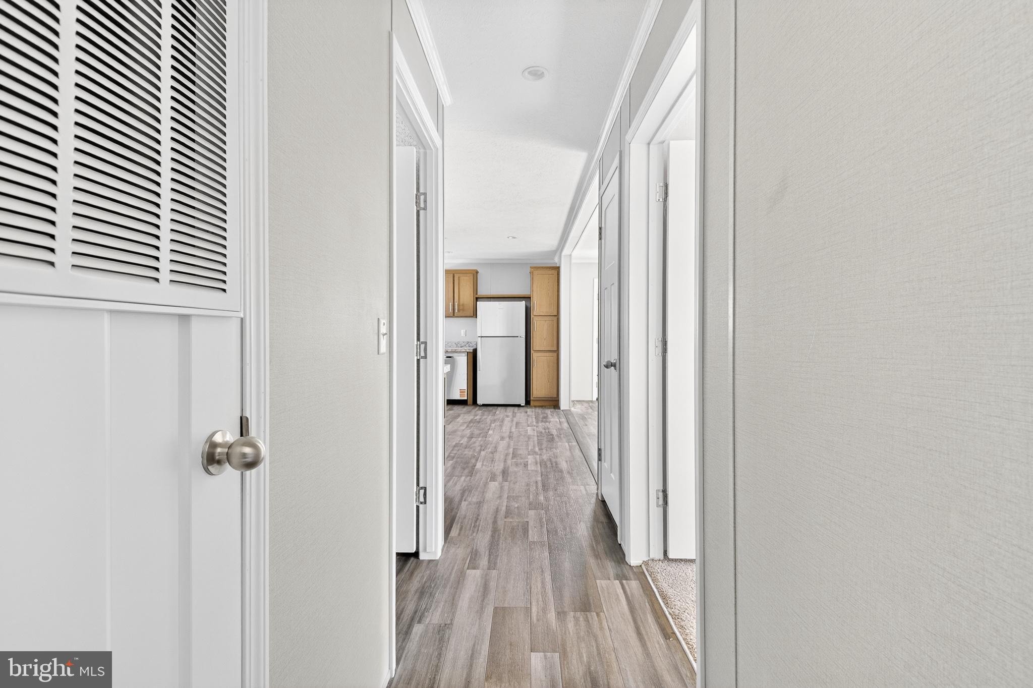 313 Bordic Road Reading, PA 19606 - Photo 15 of 27 a view of a hallway with wooden floor and staircase