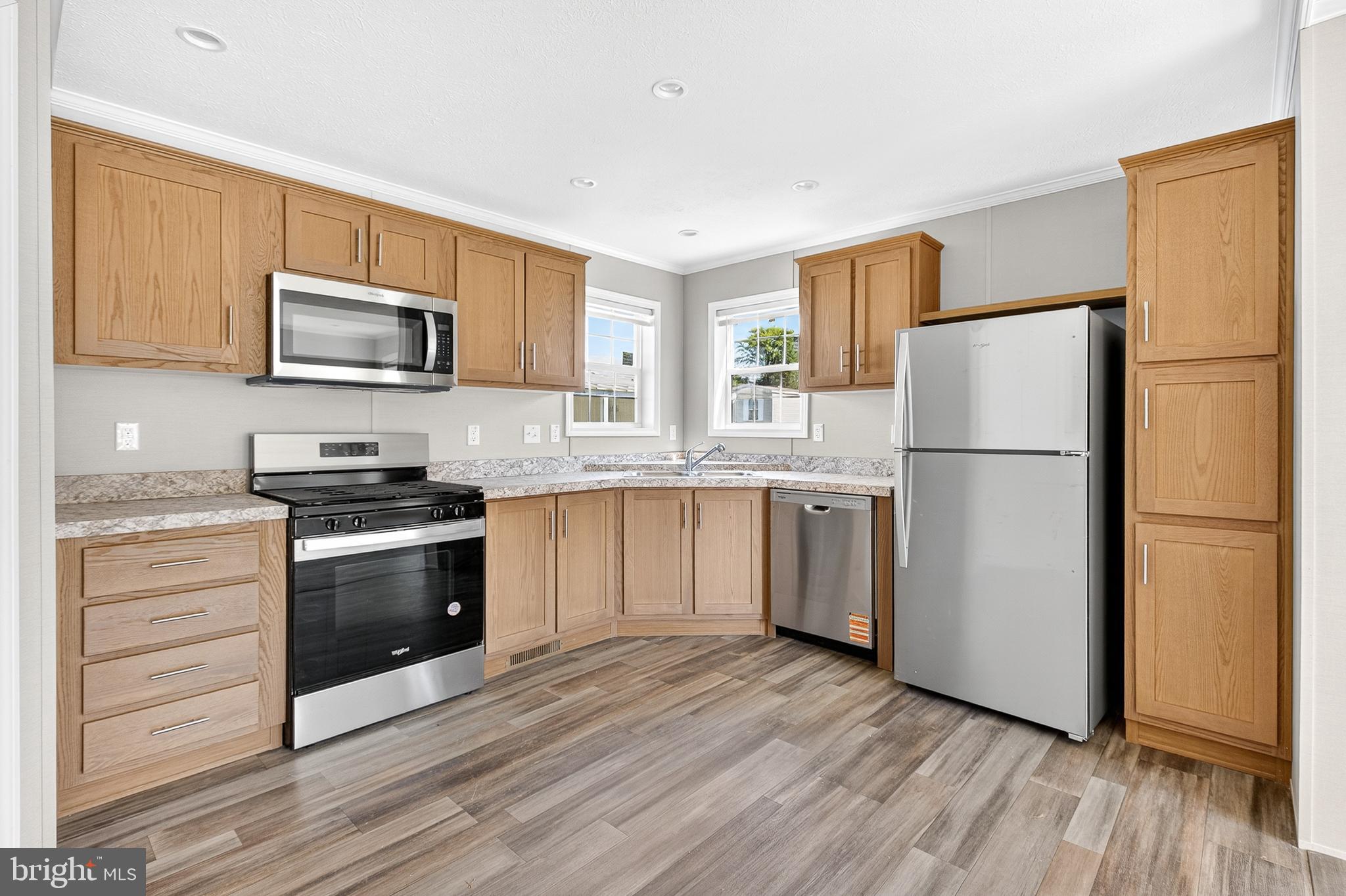 313 Bordic Road Reading, PA 19606 - Photo 19 of 27 a kitchen with granite countertop a refrigerator stove and microwave