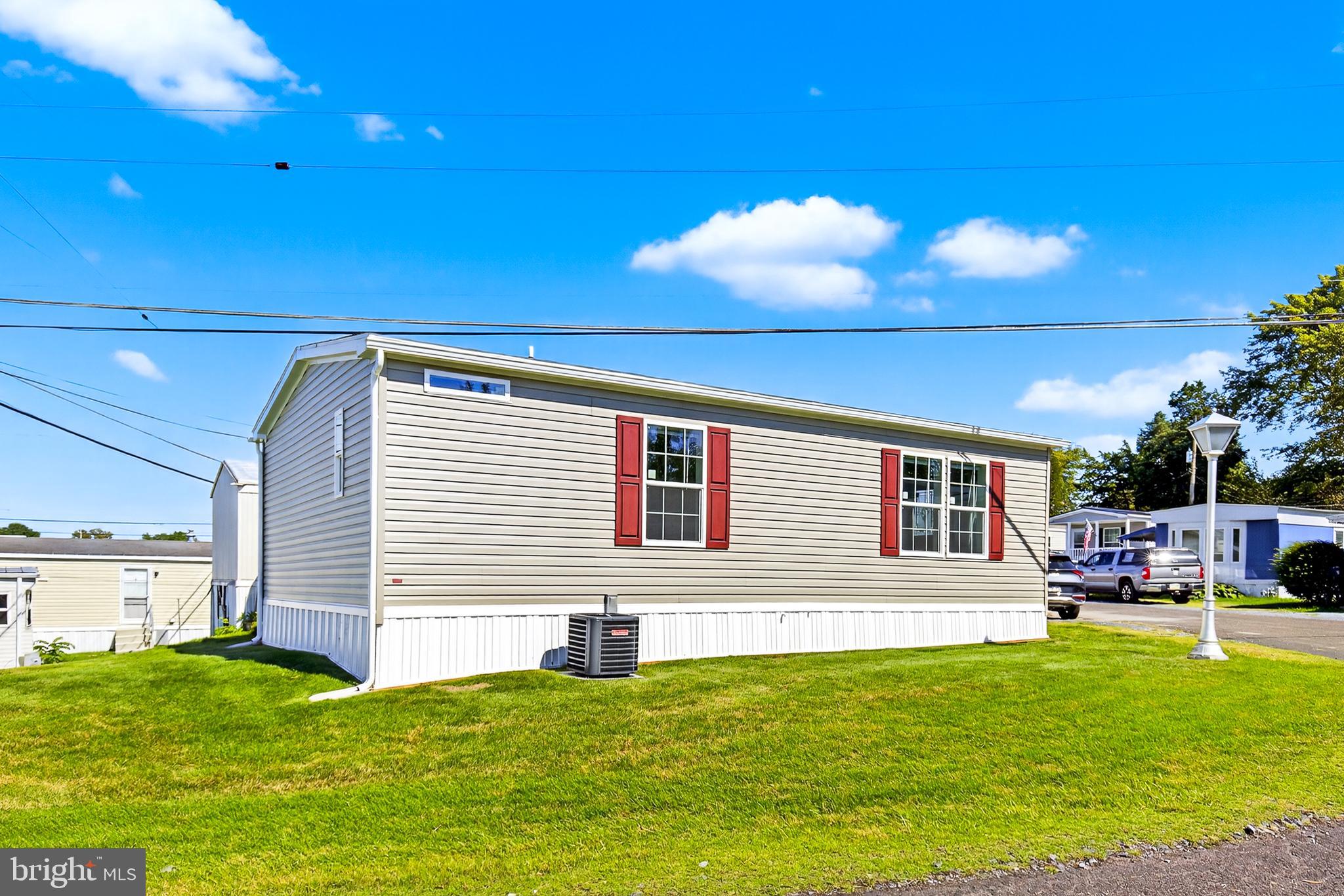 313 Bordic Road Reading, PA 19606 - Photo 2 of 27 a backyard of a house with table and chairs