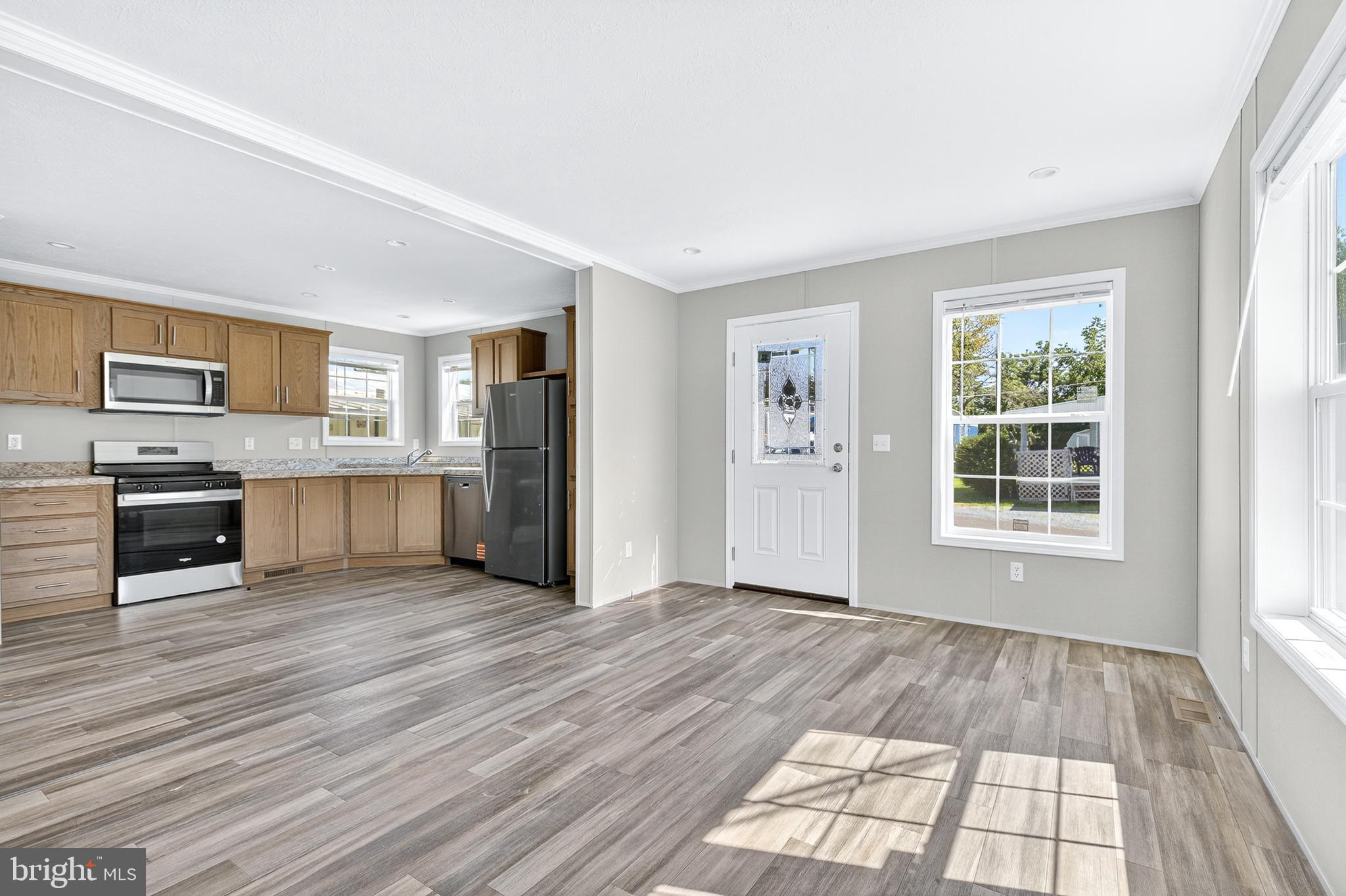 313 Bordic Road Reading, PA 19606 - Photo 21 of 27 a view of a kitchen with wooden floor electronic appliances and windows