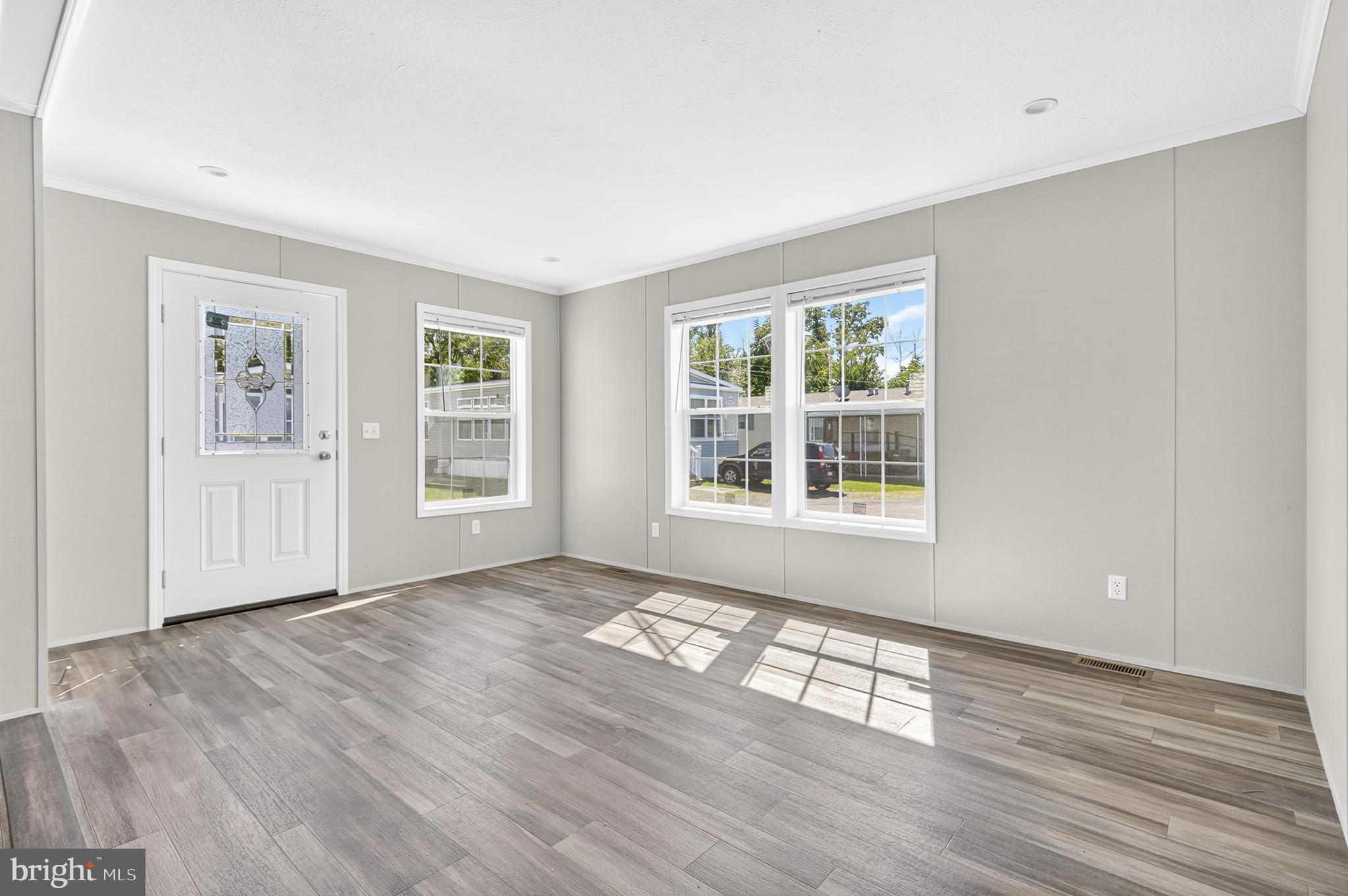 313 Bordic Road Reading, PA 19606 - Photo 22 of 27 a view of an empty room with wooden floor and a window