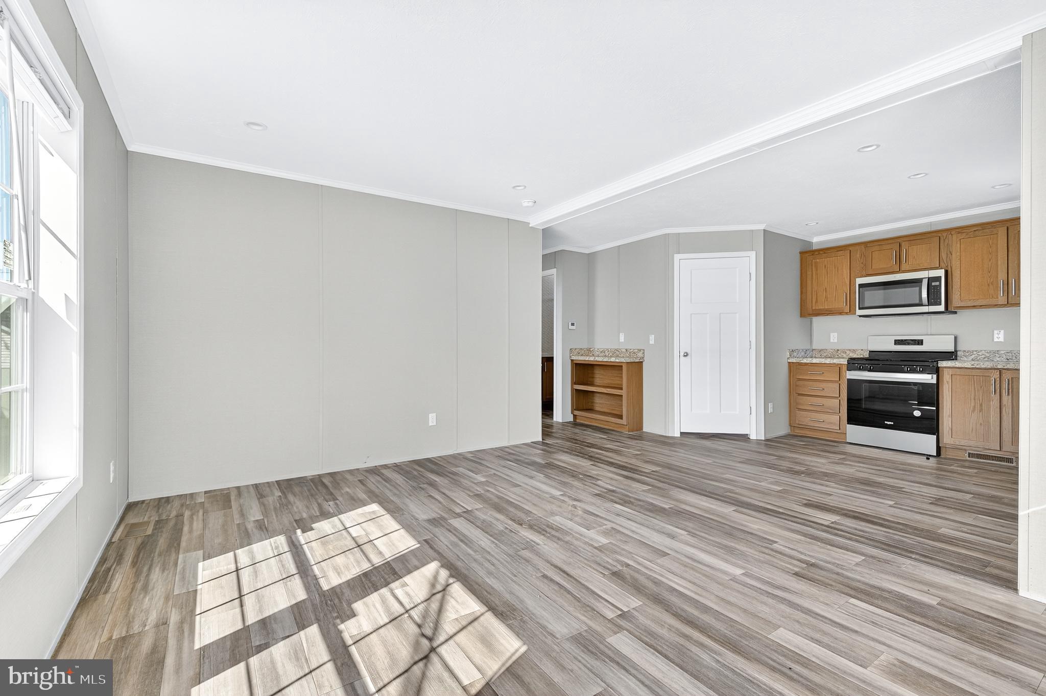313 Bordic Road Reading, PA 19606 - Photo 23 of 27 a view of empty room with wooden floor and fireplace