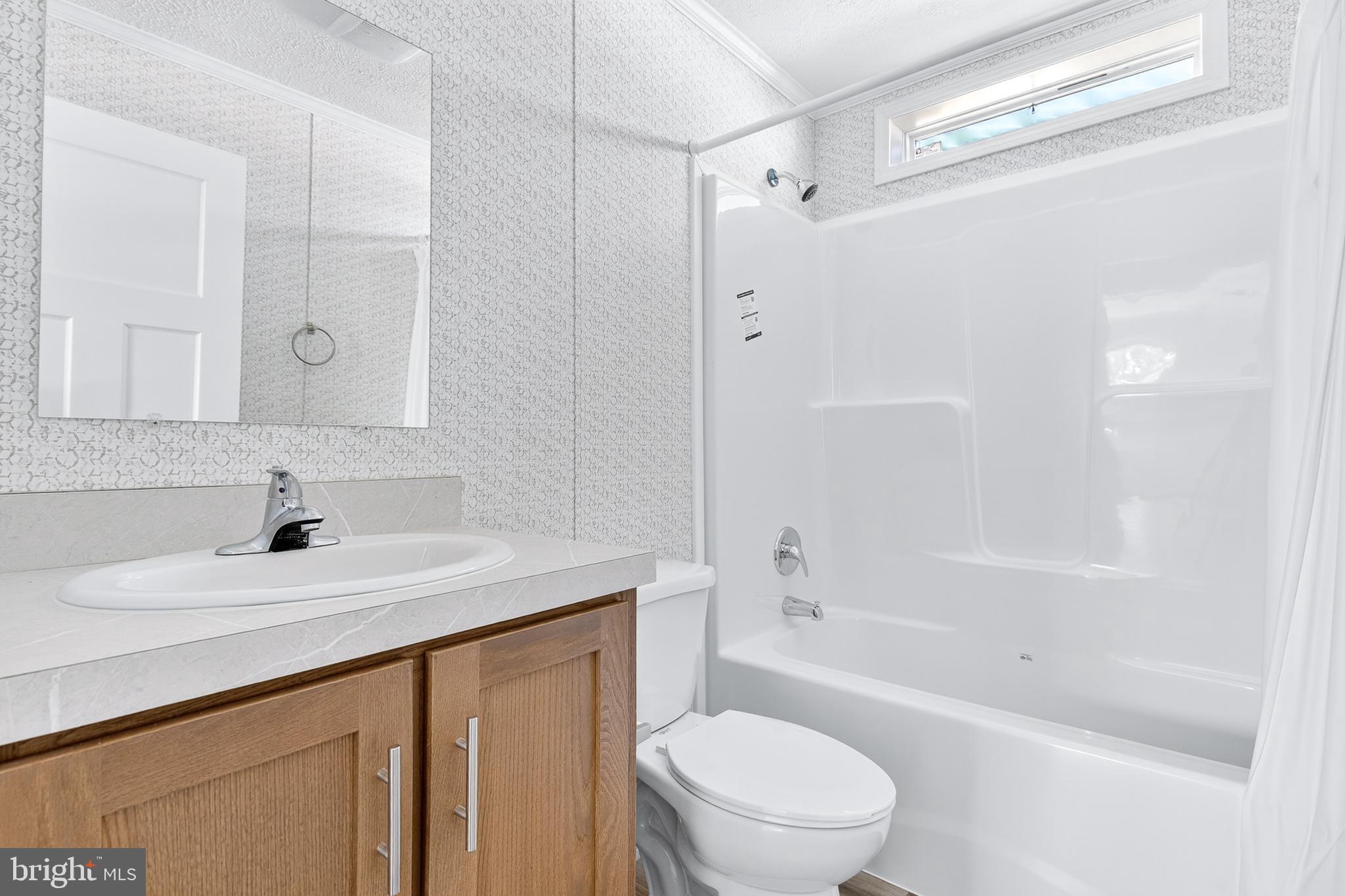 313 Bordic Road Reading, PA 19606 - Photo 9 of 27 a bathroom with a sink a toilet and a bathtub