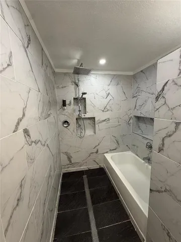 a bathroom with a sink and a shower