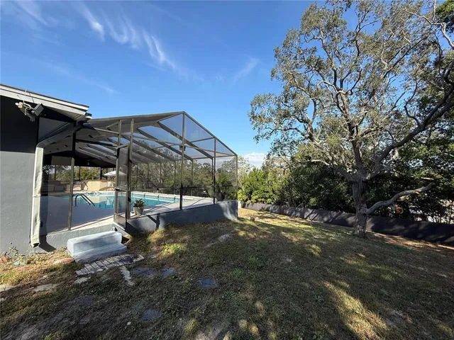 a view of a back yard of the house