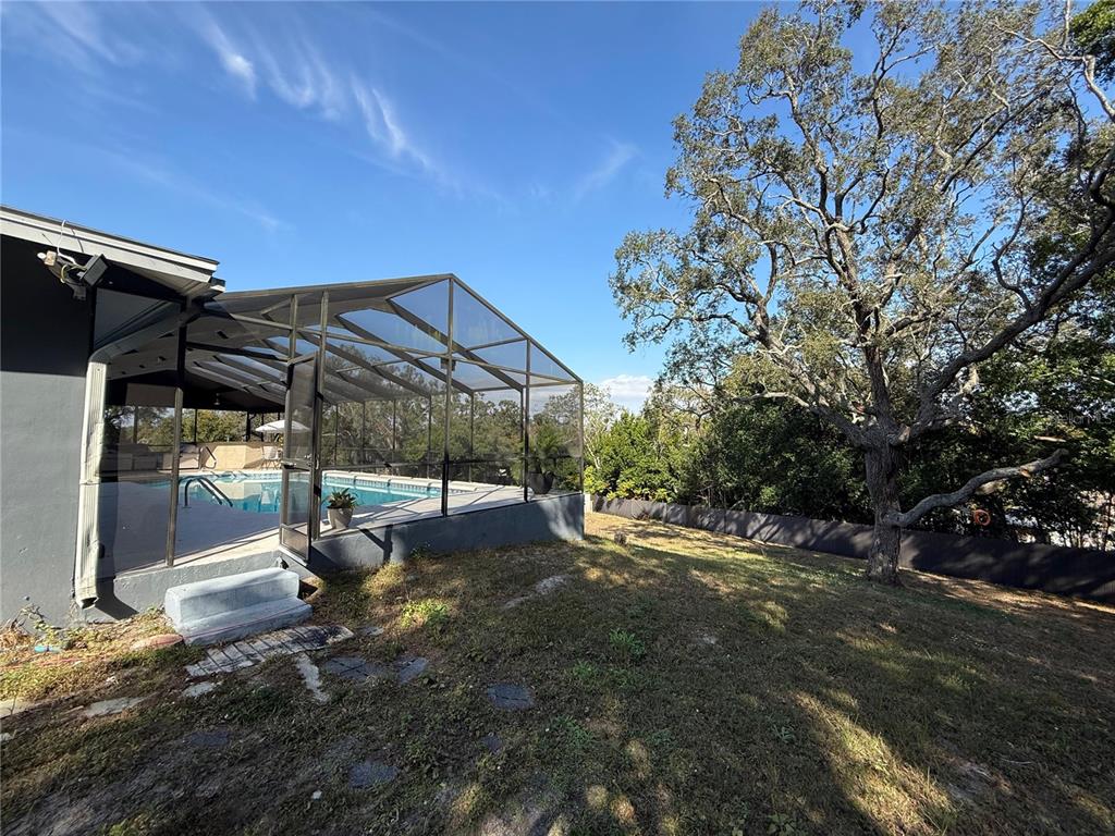 7223 Tarrytown Drive Spring Hill, FL 34606 - Photo 20 of 27 a view of a back yard of the house