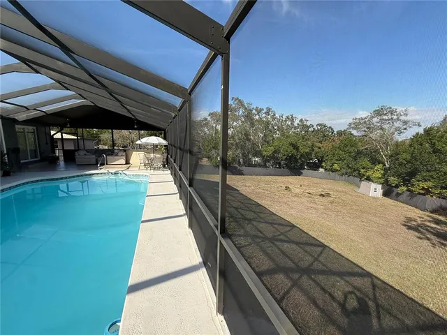 a swimming pool with a outdoor seating
