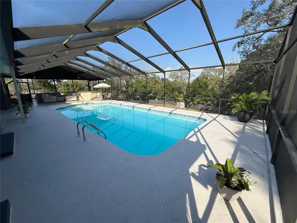 a view of a swimming pool with a patio