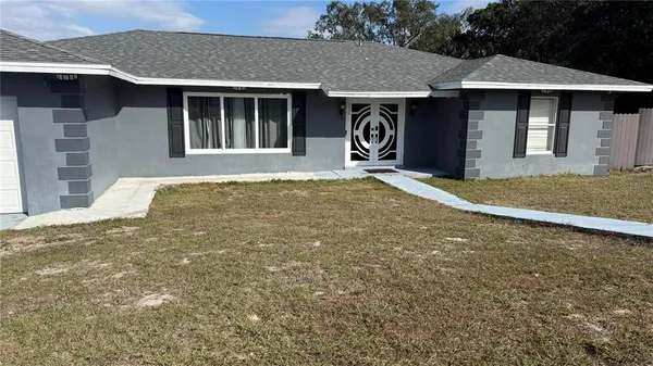 a house with yard in front of it