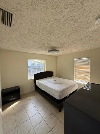 a room with pool table and window