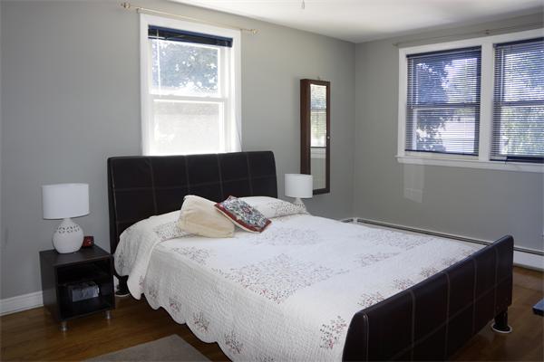 52 David Needham, MA 02494 - Photo 15 of 22 a bedroom with a bed and a window