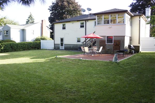 52 David Needham, MA 02494 - Photo 22 of 22 a view of a house with backyard and sitting area