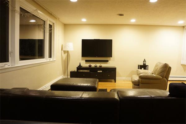 52 David Needham, MA 02494 - Photo 6 of 22 a living room with furniture and a flat screen tv