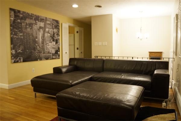 52 David Needham, MA 02494 - Photo 7 of 22 a living room with furniture and a couch