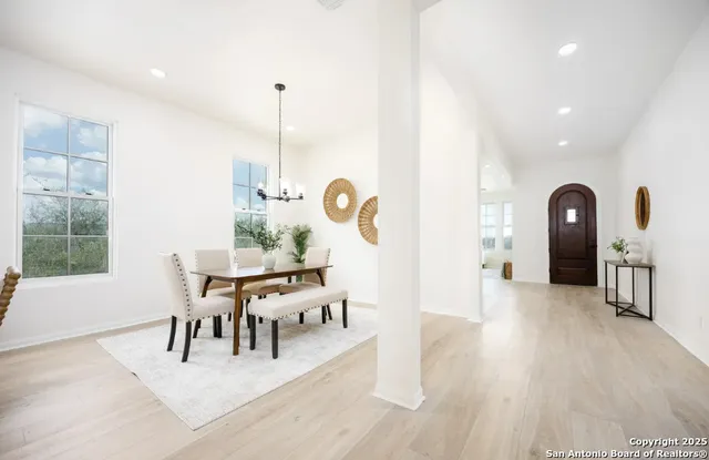 a dining room with furniture and window