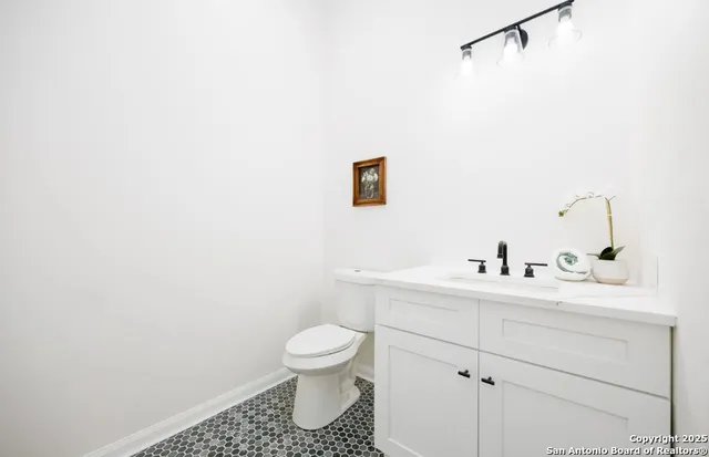 a bathroom with a toilet sink