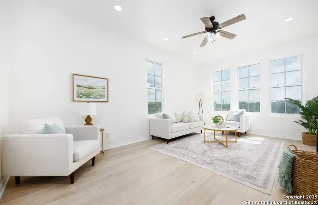 a living room with furniture and a large window
